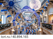 Christmas decoration of the streets. Beautiful festive landscapes in the city. GUM. The central store on Red Square. Decoration in the style of Gzhel. Moscow, December 2023. Редакционное фото, фотограф Photojuli / Фотобанк Лори