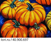 Decorative ornamental orange pumpkins. A jack-o'-lantern or jack o'lantern. Halloween or Hallowe'en, Allhalloween, All Hallows' Eve, or All Saints' Eve. Bright vegetable background - still life. Стоковое AI-изображение, AI-художник Юлия Петровская / Фотобанк Лори