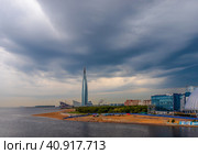 St. Petersburg, Russia - September 9, 2019. View of a skyscraper by the sea. Great skyscraper on a background of cloudy sky. Skyscraper Lakhta Center in St Petersburg is the tallest building in Europe. Редакционное фото, фотограф Андрей Степанов / Фотобанк Лори