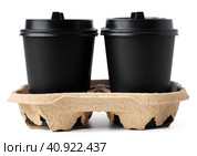 Four takeaway coffee cups in a tray isolated on white. Стоковое фото, фотограф Сергей Толмачёв / Фотобанк Лори