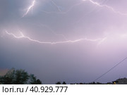 Lightning is a natural phenomenon electrostatic discharges in the atmosphere between two electrically charged regions, neutralizing in a near-instantaneous release of an average of gigajoule energy. Стоковое фото, фотограф Юлия Петровская / Фотобанк Лори