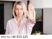 adult woman show stop gesture sign by hand saying no to domestic violence or abuse. Стоковое фото, фотограф Гладских Татьяна / Фотобанк Лори