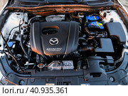Mazda 3 engine (2023 год). Редакционное фото, фотограф Art Konovalov / Фотобанк Лори