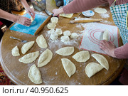 Baking homemade pies with filling, rolling out dough, shaping patty. Стоковое фото, фотограф Владимир Григорьев / Фотобанк Лори
