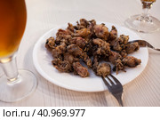 Chipirones, breaded fried calamari with lemon. Стоковое фото, фотограф Яков Филимонов / Фотобанк Лори