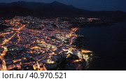 Aerial view of illuminated Nerja city at Mediterranean coast, Costa del Sol, Spain. Стоковое видео, видеограф Яков Филимонов / Фотобанк Лори