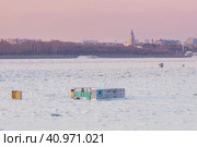 Cabin for winter swimming in the hole on the border between China and Russia. Amur river. In the background is the city of Heihe, China. Inscription Walruses of the Amur. Стоковое фото, фотограф Алексей Игнатов / Фотобанк Лори