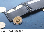 Crypto-currency: Leather wallet with metal bitcoin coins. Стоковое фото, фотограф Енваев Андрей / Фотобанк Лори