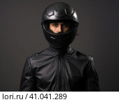 Biker in a modern helmet. Стоковое AI-изображение, AI-художник Кирилл Черезов / Фотобанк Лори