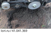 Powerful cultivator, Tiller. Gardening. Spring work on the farm. Land cultivation with a Motor ripper. Man plows the ground. Spring soil preparation for seeding. Husbandman, grower. Moto plow working. Стоковое видео, видеограф Марина Демидюк / Фотобанк Лори