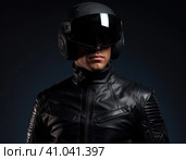 Biker in a modern helmet. Стоковое AI-изображение, AI-художник Кирилл Черезов / Фотобанк Лори