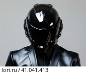 Biker in a modern helmet. Стоковое AI-изображение, AI-художник Кирилл Черезов / Фотобанк Лори
