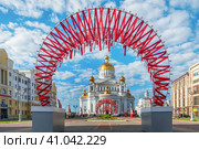 Saransk, Mordovia, Russia. 05.06.2023. Cathedral of St. Theodore Ushakov in Saransk, consecrated in 2009, Russia. It is named after the Russian saint and Admiral Fyodor Ushakov. inscription above the entrance reads: Cathedral of the Holy Righteous Warrior Feodor Ushakov. Редакционное фото, фотограф Оксана Медведева / Фотобанк Лори