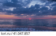 Sunset over the sea. The sun disappeared. A sky of delicate blues and pinks. Small waves leave foam on the beach pebbles. Black Sea. Russia. Стоковое фото, фотограф Вера Ивановна Кубарева / Фотобанк Лори