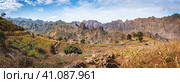 Gorgeous panorama view of the fields of intensive terrace cultivation surrounded by the huge barren mountain peaks, walls and cliffs. Santo Antao Island, Cape Verde. Стоковое фото, фотограф Igor Tichonow / Фотобанк Лори