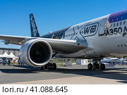 BERLIN, GERMANY - JUNE 23, 2022: Wide-body jet airliner Airbus A350-900 XWB. Exhibition ILA Berlin Air Show 2022. Редакционное фото, фотограф Sergey Kohl / Фотобанк Лори