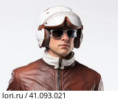 Biker in a modern helmet. Стоковое AI-изображение, AI-художник Кирилл Черезов / Фотобанк Лори