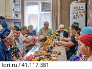 Residents of a Siberian village celebrate the Muslim holiday Kurban Bayram at home. Eid al-Adha, the festival of sacrifice. (2021 год). Редакционное фото, фотограф Ирина Кононова / Фотобанк Лори