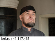 Close up portrait of serious senior asian man wearing skullcap. Стоковое фото, фотограф Ирина Кононова / Фотобанк Лори