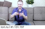 A man blogs about edged weapons showing off various knives on camera. Стоковое видео, видеограф Сергей Сергеев / Фотобанк Лори