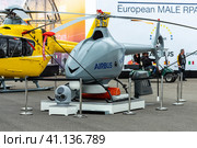 BERLIN, GERMANY - APRIL 25, 2018: An unmanned reconnaissance helicopter Airbus VSR700. Exhibition ILA Berlin Air Show 2018. Редакционное фото, фотограф Sergey Kohl / Фотобанк Лори