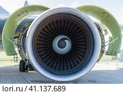 BERLIN, GERMANY - JUNE 03, 2016: Turbofan engine General Electric CF6-80C2 of medical aircraft Airbus A310-304 MRTT MedEvac "August Euler" (Luftwaffe). Close-up. Exhibition ILA Berlin Air Show 2016. Редакционное фото, фотограф Sergey Kohl / Фотобанк Лори