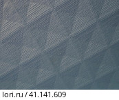 Geometric abstract background from triangles, squares and lines. Three-dimensional bulge. The volume and flex of the diagonally positioned foam material. Blue, gray and pink shades. Стоковое фото, фотограф Юлия Петровская / Фотобанк Лори