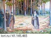 Konevets, Russia 22 July 2023 . Konevets Monastery on an island on Lake Ladoga. Picturesque paintings on the walls of the archway under the bell tower. Depicts a visit to the Konevsky Monastery by Novgorod Archbishop Euthymius, a companion of the Venerable Arsenius. Редакционное фото, фотограф Оксана Медведева / Фотобанк Лори