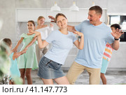 Home holiday - large family dancing together in living room at home. Стоковое фото, фотограф Яков Филимонов / Фотобанк Лори