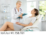Sick female patient having aches and visiting doctor. Стоковое фото, фотограф Яков Филимонов / Фотобанк Лори