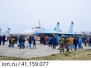 Military aircraft fighters and other aircraft at the Krasnodar airfield. Exhibition of military equipment in honor of the defender of the fatherland. Festive event. People inspect military equipment. (2017 год). Редакционное фото, фотограф Леонид Еремейчук / Фотобанк Лори