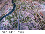 Moscow, Russia - November 16, 2019: The architectural Moscow Grand maket, layout of buldings and roads. Bird's eye view. Fish eye lens. Редакционное фото, фотограф YuryKara / Фотобанк Лори