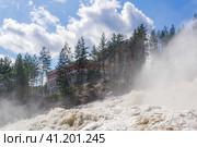 Waterfall during opened locks for idle discharge of water at a small hydroelectric power station. Стоковое фото, фотограф Евгений Харитонов / Фотобанк Лори
