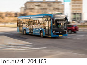 Electrobus drive down the street in Moscow, front side view. Electric bus in motion. Редакционное фото, фотограф Константин Григорьев / Фотобанк Лори