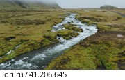 Aerial flight through epic Iceland landscape over the Foss river. Scandinavian amazing nature. Стоковое видео, видеограф Igor Tichonow / Фотобанк Лори