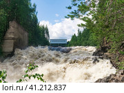 Waterfall during opened locks for idle discharge of water at a small hydroelectric power station. Стоковое фото, фотограф Евгений Харитонов / Фотобанк Лори