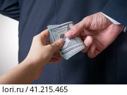 Businessman with money in studio. Corruption concept. Hundred dollar bills. Стоковое фото, фотограф Станислав Тарко / Фотобанк Лори