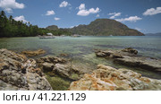 El Nido bay and mountains, Palawan, Philippines. Bangka fishing boat floating in the bay shallow water. Стоковое фото, фотограф Igor Tichonow / Фотобанк Лори