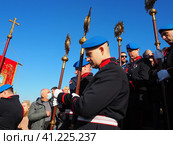 Sremska Mitrovica, Serbia, January 19, 2022. Christian holiday Epiphany. Mass bathing of people in the river. People in full dress with church utensils, litanies, flags and staffs descend the stairs. Редакционное фото, фотограф Юлия Петровская / Фотобанк Лори