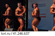 Russia, Nizhny Novgorod, Volzhskaya embankment 21, 05.06.2021. Athletes, men in swimming trunks on stage, bodybuilding performance. Россия, Нижний Новгород, Волжская набережная, 21, 05.06.2021. Спортсмены, мужчины в плавках на сцене, выступление по бодибилдингу. Высококачественные кадры в формате FullHD. Редакционное видео, видеограф Egor Sarantstv / Фотобанк Лори