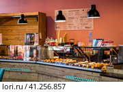 The interior of a stylish, modern cafe, bakery Croissant Dore in Nizhny Novgorod. Russia, Nizhny Novgorod, August 2023. Редакционное фото, фотограф Photojuli / Фотобанк Лори