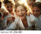 A group of teenage wrestlers in a kimono. Стоковое AI-изображение, AI-художник Кирилл Черезов / Фотобанк Лори