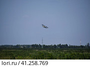 The spraying of fertilizers and pesticides on the field with the aircraft. Стоковое фото, фотограф Леонид Еремейчук / Фотобанк Лори