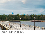View from Lake Ladoga on the pier of Konevets Island. In the distance are the domes of the Konevets Nativity of the Virgin Mother of God Monastery. Стоковое фото, фотограф Оксана Медведева / Фотобанк Лори