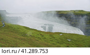 Gullfoss waterfall and silhouette of tourist standing on view platform. Icelandic panoramic landscap. Стоковое фото, фотограф Igor Tichonow / Фотобанк Лори