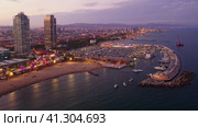 Drone view of the evening Barcelona, the capital of Catalonia, on the Mediterranean coast, Spain. Стоковое видео, видеограф Яков Филимонов / Фотобанк Лори