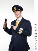Young man in the form of a passenger plane pilot. Стоковое фото, фотограф Андрей Аркуша / Фотобанк Лори