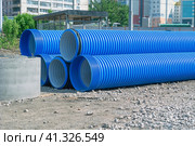 Pipes made of polyvinyl chloride. Plastic corrugated pipes for carrying out communications during construction and repair. Laying pipes in trenches. Стоковое фото, фотограф Эдуард Белкин / Фотобанк Лори