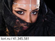 Beautiful Woman in Middle Eastern Niqab veil on isolated black background. Стоковое фото, фотограф Андрей Аркуша / Фотобанк Лори