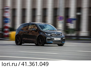 BMW i3 electric car drives down the street, front side view. Редакционное фото, фотограф Константин Григорьев / Фотобанк Лори